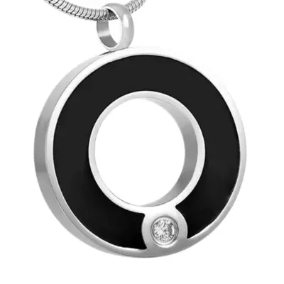 Dije conmemorativo relicario de acero inoxidable en forma de círculo plateado/negro con cristal - Urnas Sacbé